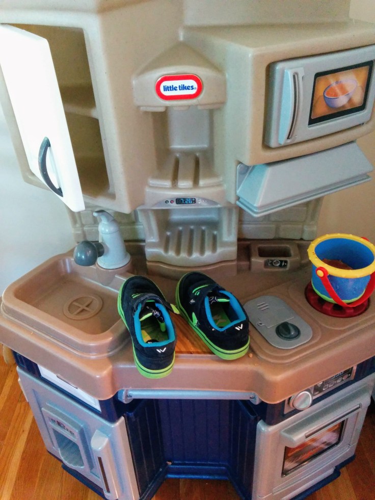 Shoes on play kitchen