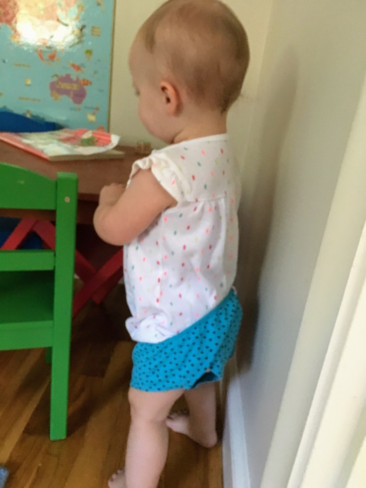 Toddler in underwear over onsie