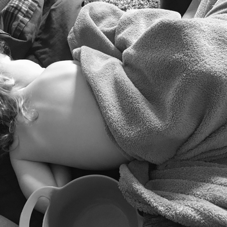 Sick baby lying down on couch