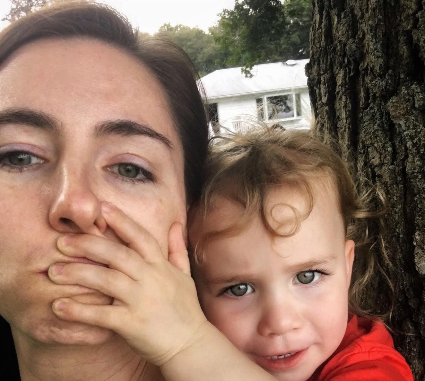 Kat covering moms mouth