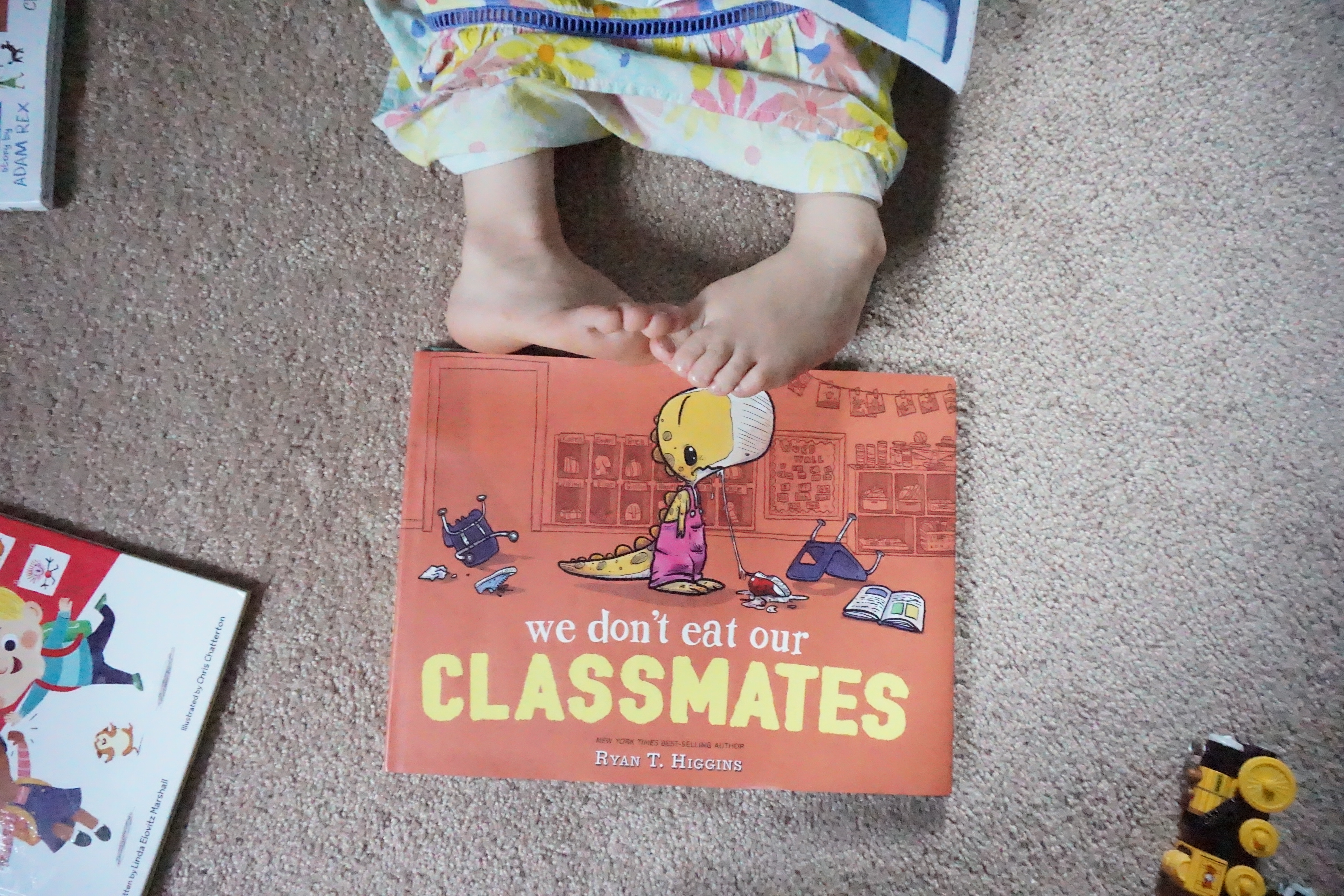 We Don't Eat Our Classmates book w/ toddler toes