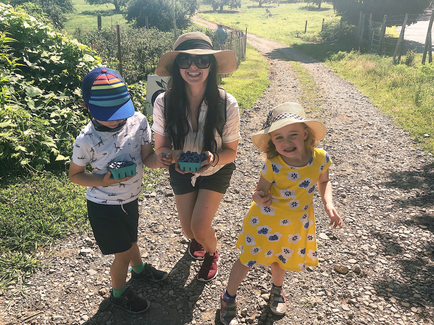 Mom and kids blueberry picking - 1 year after cancer diagnosis